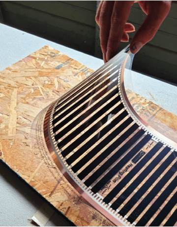 Attaching Black Gold heat film to subfloor with adhesive